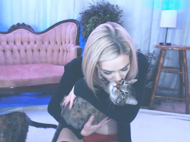 Doll_Parts Enjoys A Cuddle With Furry Felines
